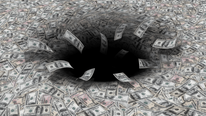 Hundred dollar bills swirling into a black hole, representing financial loss due to lack of employee appreciation.